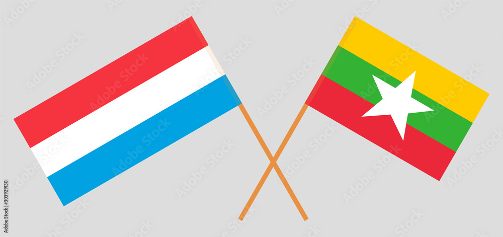 Crossed flags of Myanmar and Luxembourg