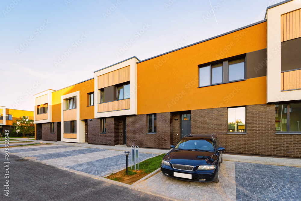 Φωτογραφία Apartment town house residential building and car parked in the street