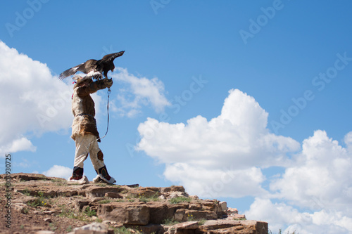 Kazakh eagle hunter in altai mountains, mongolia photo