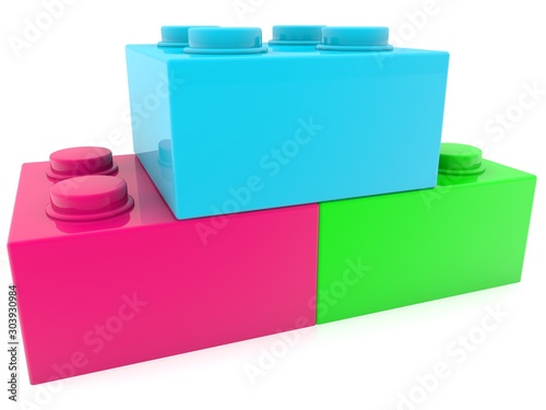 Three different colored toy bricks in close-up