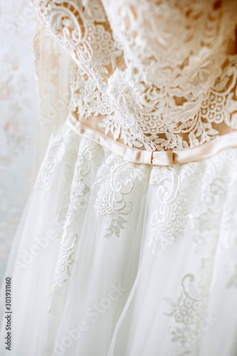 luxury wedding dress. Details Close-up Of A White Bridesmaid Dress. Elegant outfit of the bride.
