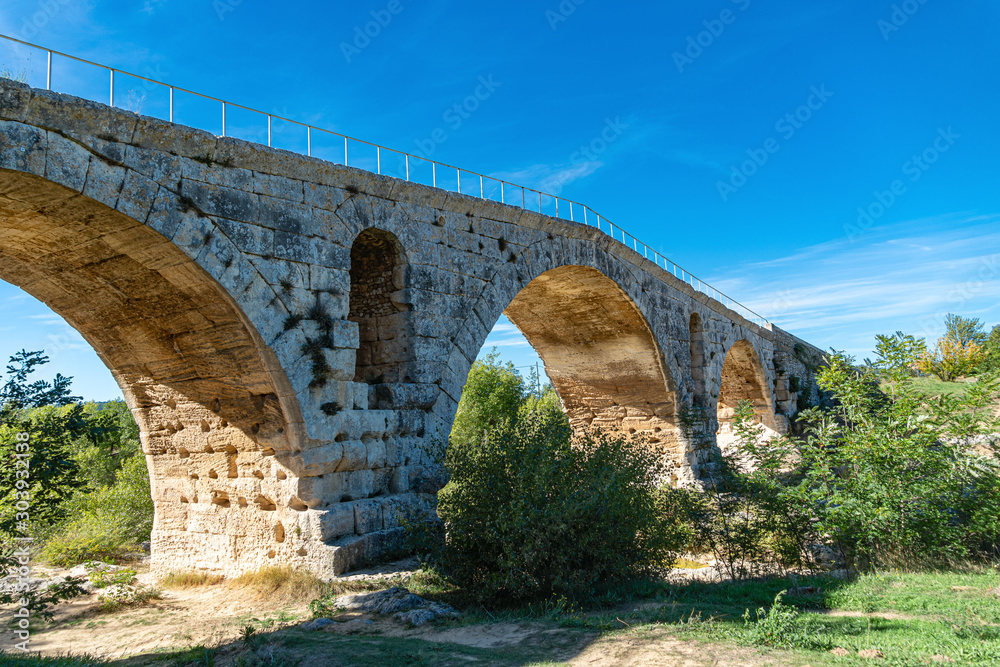 Antique roman bridge made with stones, France