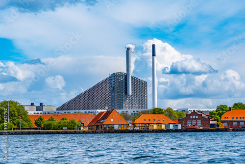 View of Amager Bakke factory with skiing slope on the rooftop in Copenhagen, Denmark photo