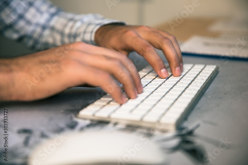 man working in computer keyboard