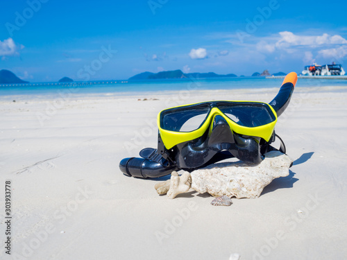 Snorkel on white sand beach with blue sky background, Enjoy snorkeling Tour on your holidays