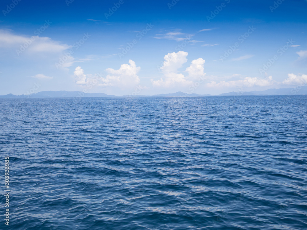 Blue sea and sky with white clouds at beauty day light Blue sea and sky with white clouds at beauty day light