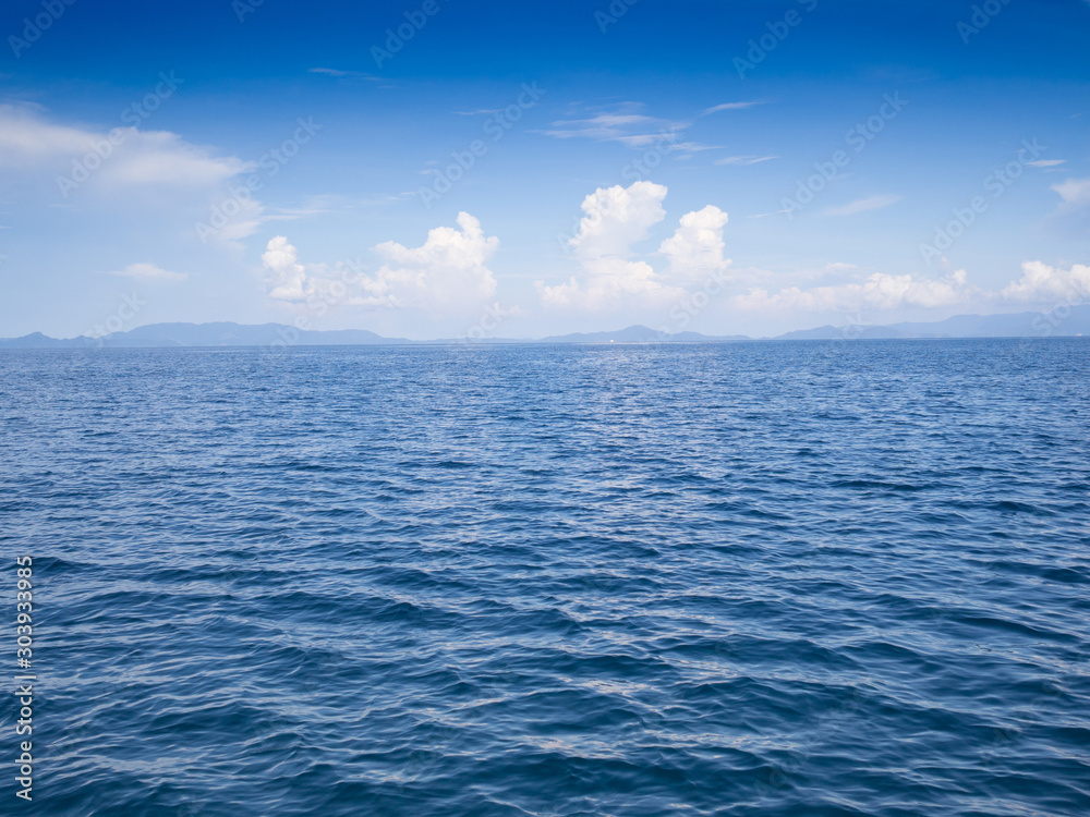 Blue sea and sky with white clouds at beauty day light