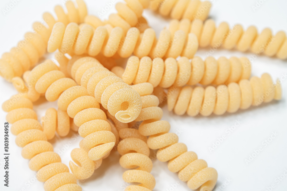 pasta from durum wheat curls fusilli, cavatappi, unprepared, raw pasta cellentani handmade isolated on white background close up macro pasta from durum wheat curls fusilli, cavatappi, unprepared, raw pasta cellentani handmade isolated on white background close up macro