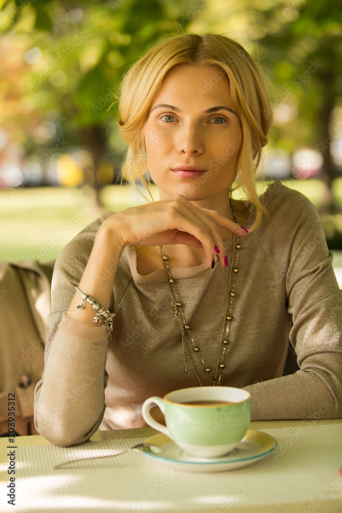 portrait of a beautiful young woman in park. portrait of a beautiful young woman in park.