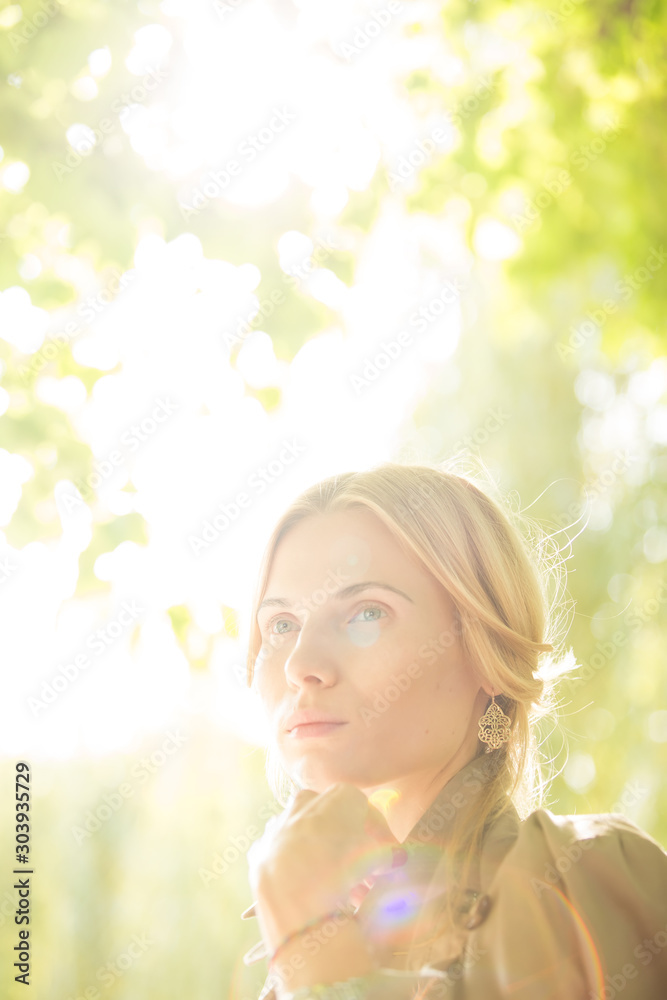 Fototapeta premium portrait of a beautiful young woman in park.