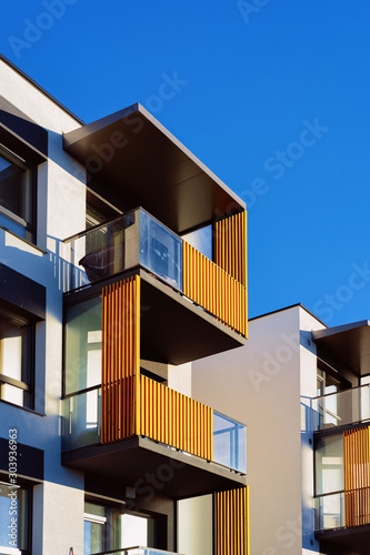 Residential apartment house facade with a blank place for the copy space. Blue sky on the background.