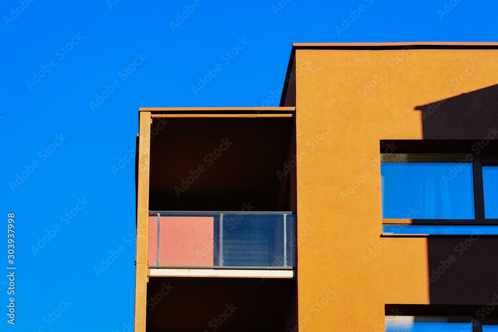 Apartment residential house facade and an empty place for the copy space. Blue sky on the background.