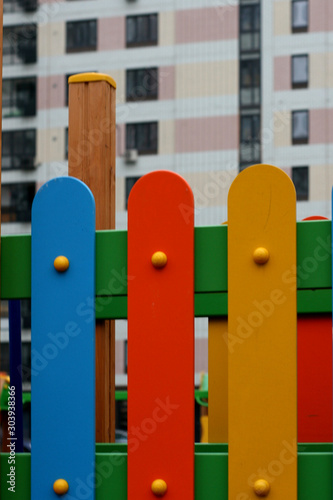 fragment of multicolored fence children's Playground