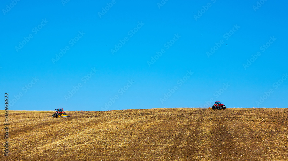 Agricultural Landscape. Tractors working on the field. Agricultural Landscape. Tractors working on the field.