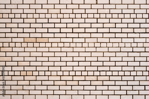 Clean smooth brick wall close-up. Texture of a brick wall