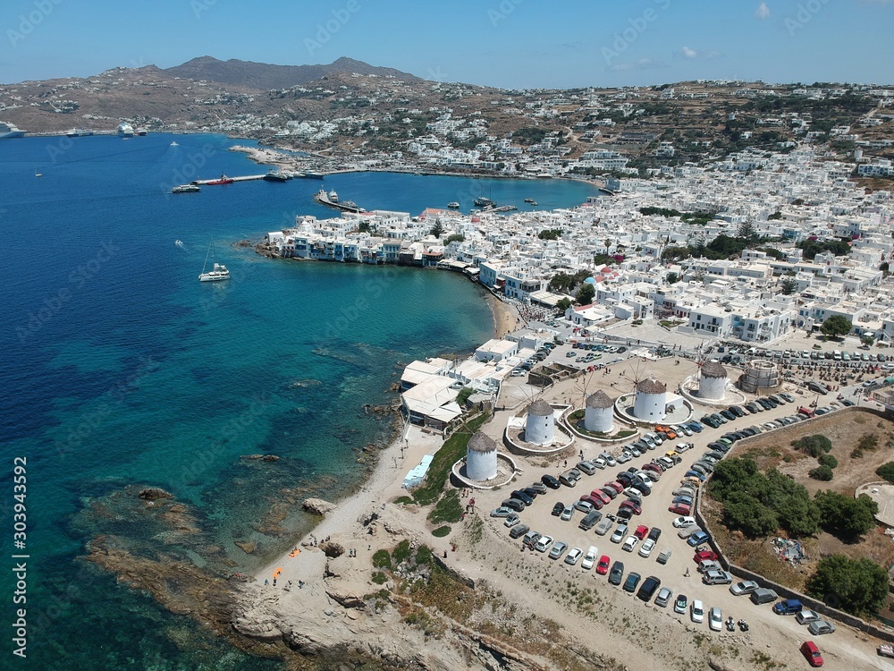 MYKONOS, GREECE : aerial view on the island and port side at sun weather