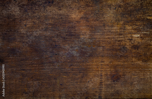 Image of a wooden table in front of an abstract background.