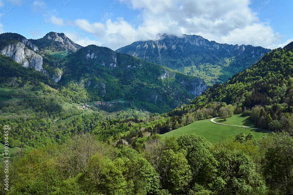Naklejka premium road and village in Mountains in the Alps in the French Savoie..