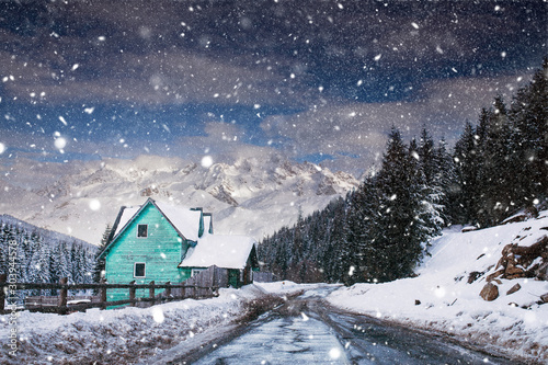 Wooden cottage in a fairy-tale winter landscape.