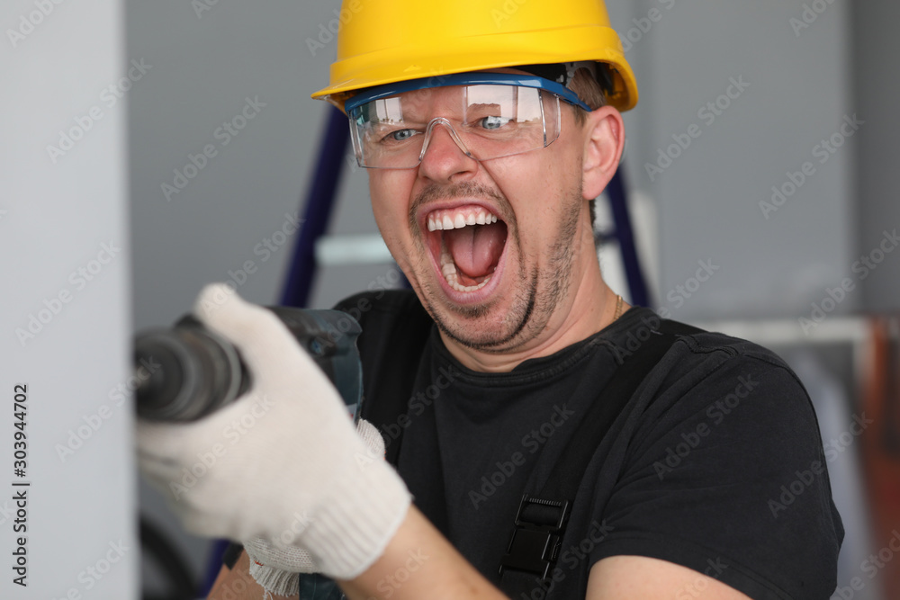 Fotografie Funny man with perforator