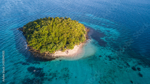 Aerial view on the small green isolated island 