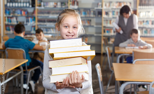 Preteen girl with books