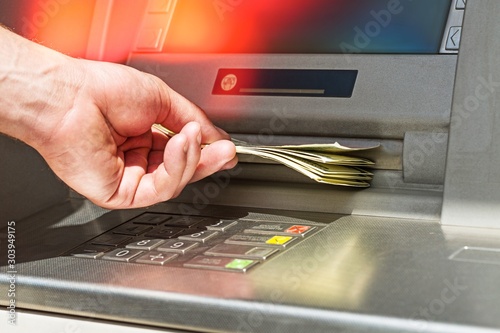 Atm bank banking paper currency bank teller removing currency