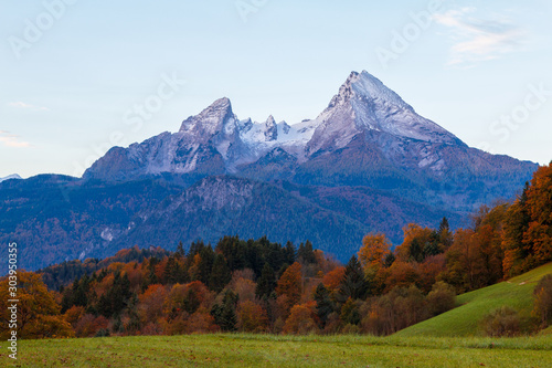 Typical mountain scenery in the background of the famous Watzmann Mountains in beautiful autumn colors near the cozy Berchtesgaden town