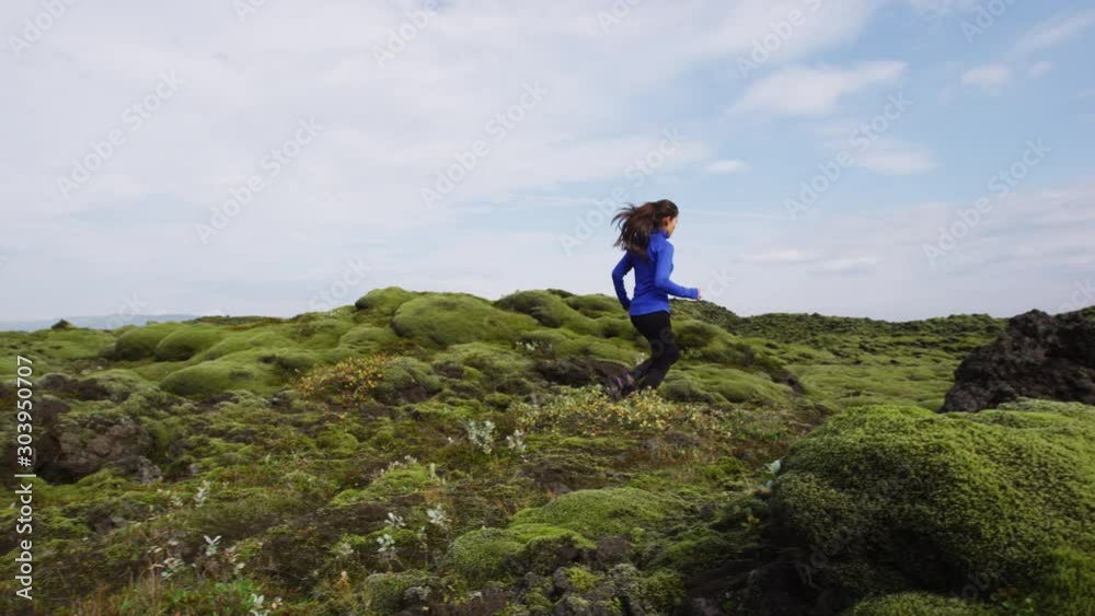 Fitness Athlete trail runner - running woman exercising. Fit female sport fitness model training jogging outdoors living healthy lifestyle in beautiful nature, Iceland. Shot on RED. Fitness Athlete trail runner - running woman exercising. Fit female sport fitness model training jogging outdoors living healthy lifestyle in beautiful nature, Iceland. Shot on RED.
