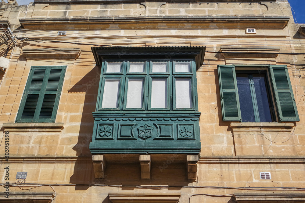 Historic residential buildings, decorated with colorful wooden Maltese balconies, Victoria, Gozo, Malta