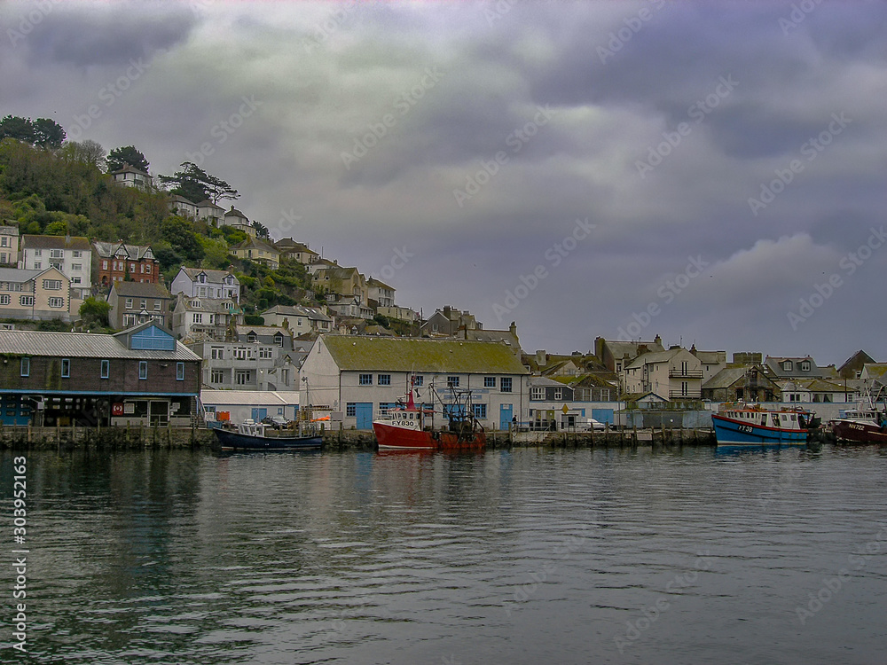 Boats on the river in the small coastal town of Looe in Cornwall, UK