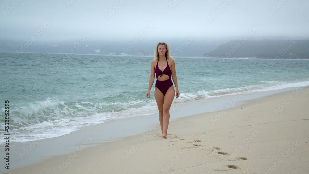 Relaxing walk along a sandy beach at the ocean - travel photography Relaxing walk along a sandy beach at the ocean - travel photography