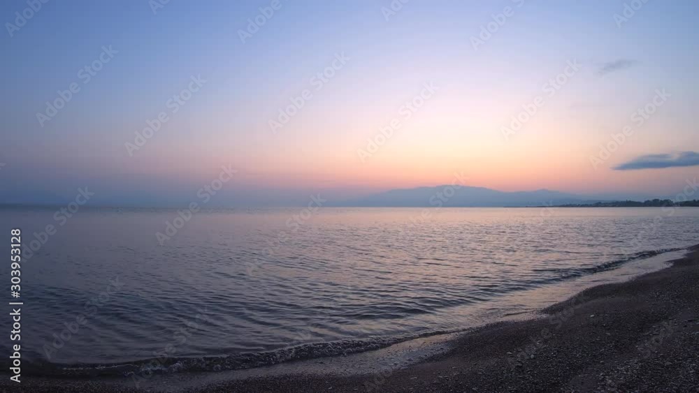 Amazing sunrise over the tropical beach. Yellow sun over sea. Orange colors waves. Nature background. Beautiful serene scene. Morning. Sunlight reflect on water surface. Time-lapse Amazing sunrise over the tropical beach. Yellow sun over sea. Orange colors waves. Nature background. Beautiful serene scene. Morning. Sunlight reflect on water surface. Time-lapse
