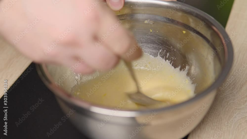 Siring up the ingredients in a bowl. Close up shot. Siring up the ingredients in a bowl. Close up shot.