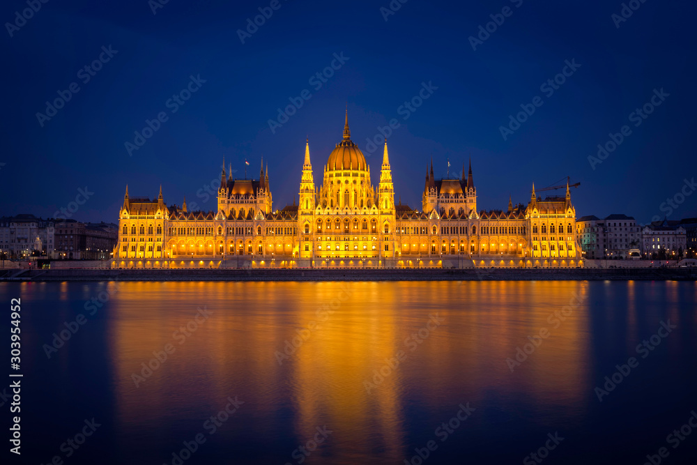 The Hungarian Parliament in symmetry after sunset in blue hour.