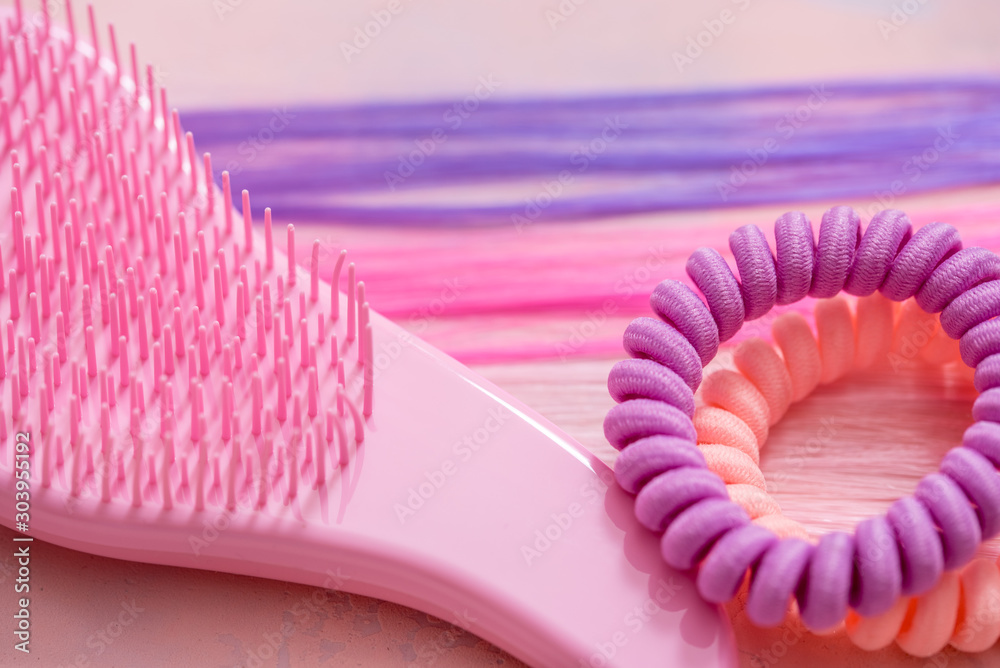 pink comb, purple bright hair. Decoration for teenage girls. Silicone  rubber band Stock Photo | Adobe Stock