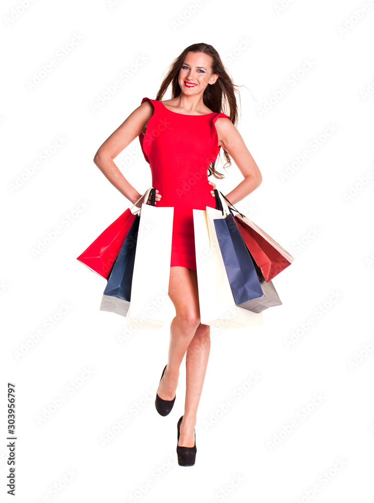 Shopping. Fashion young woman portrait isolated. Happy girl hold shopping bags.