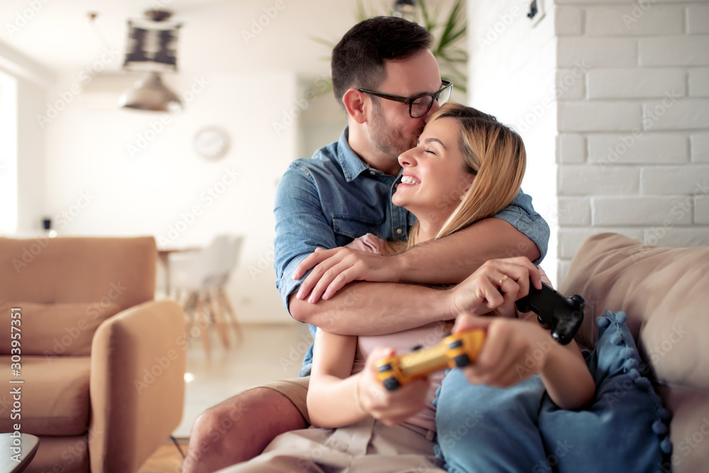 Couple playing video game Couple playing video game