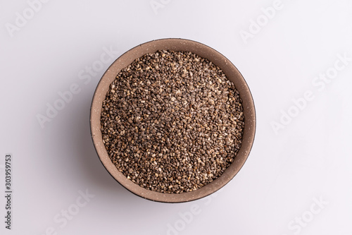 Chia seeds isolated on white background, angle view, copy space, studio shot, soft light. Latin name (Salvia hispanica).