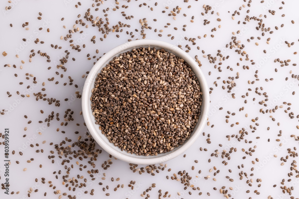 Chia seeds isolated on white background, angle view, copy space, studio shot, soft light. Latin name (Salvia hispanica). Chia seeds isolated on white background, angle view, copy space, studio shot, soft light. Latin name (Salvia hispanica).