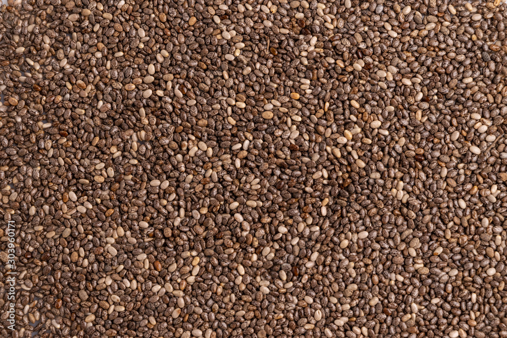 Chia seeds isolated on white background, angle view, copy space, studio shot, soft light. Latin name (Salvia hispanica). Chia seeds isolated on white background, angle view, copy space, studio shot, soft light. Latin name (Salvia hispanica).