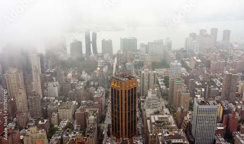 Top view of New York skyline in rainy and cloudy day. Skyscrapers of NYC in the fog