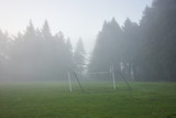 Soccer field in a park on a misty fall morning.