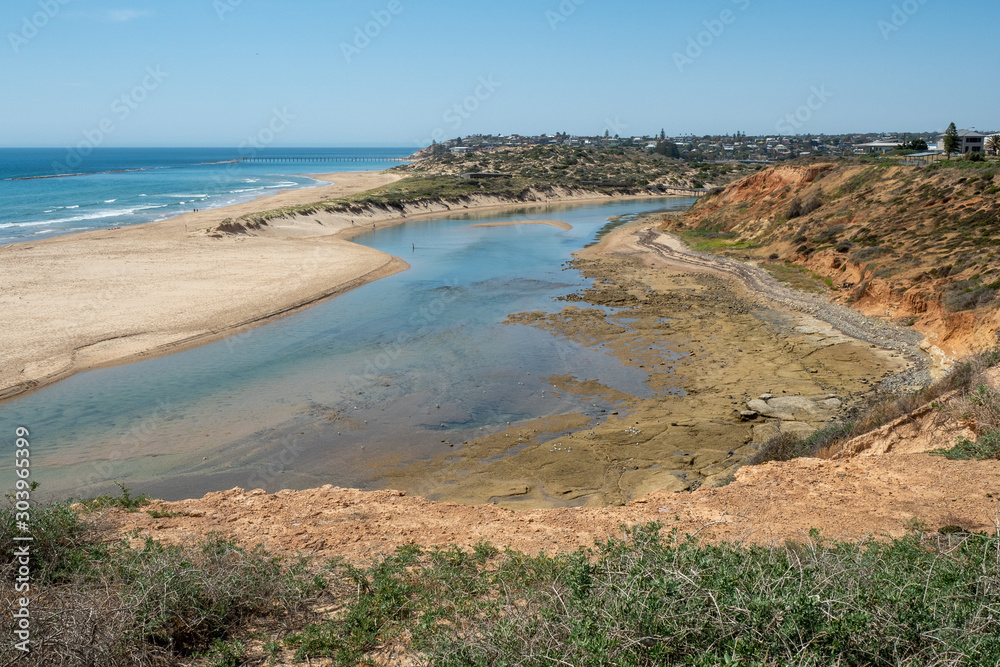 Onkaparinga River on a bright sunny day at low tide in Port Noarlunga South Australia on 19th November 2019