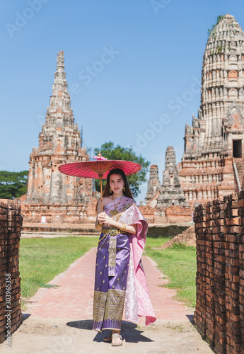 Thai women with traditional Thai suit in temple © Weerapat
