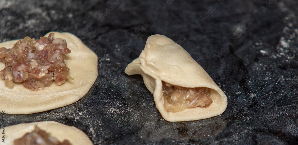 We cook dumplings, minced meat, dough, food. We cook dumplings, minced meat, dough, food.