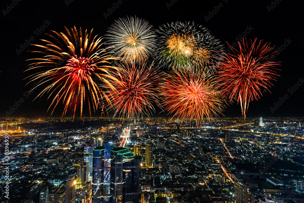 Fireworks celebrating over Bangkok cityscape at night, Thailand