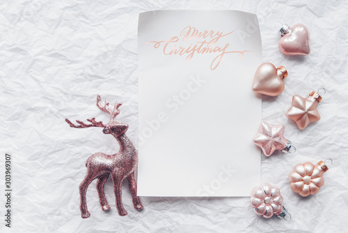 Creative composition with Cerulean deer and Christmas decorations in pastel colors. Flat lay, minimalism. photo