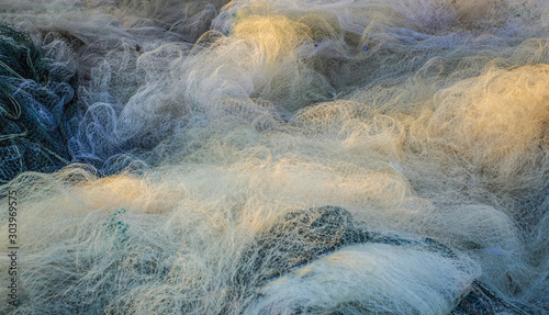 Fishing net heap on the port © grafixme