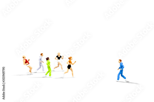 Business Leader and Teamwork Concept : Miniature people as alone runner jogging opposite direction with mass of other runners isolated on white background.